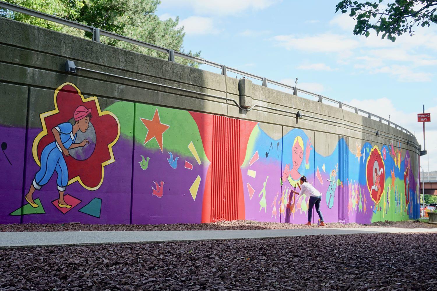 Artist Liz Zunon putting the finishing touches on "Geraldine's Reverie." Photo by All Over Albany