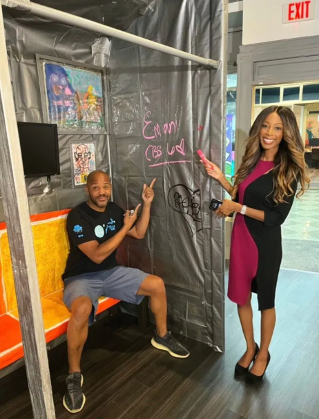 CBS 6's Emani Payne and Truemaster Trimingham checking out his art work for the Can't Stop Won't Stop art exhibit.jpg